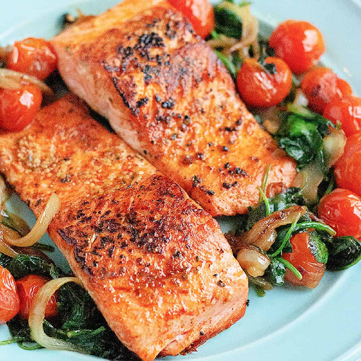 Everything you need to know about pan seared salmon. From what salmon to get to a fool proof how-to. Watch the step-by-step video tutorial to learn how to make the best pan seared salmon that's crispy on the outside and juicy on the inside. 
