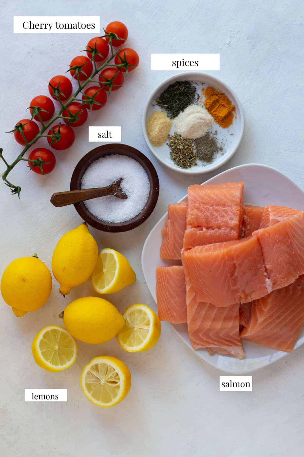 To make this recipe you need salmon, spices, salt, lemon and tomatoes.