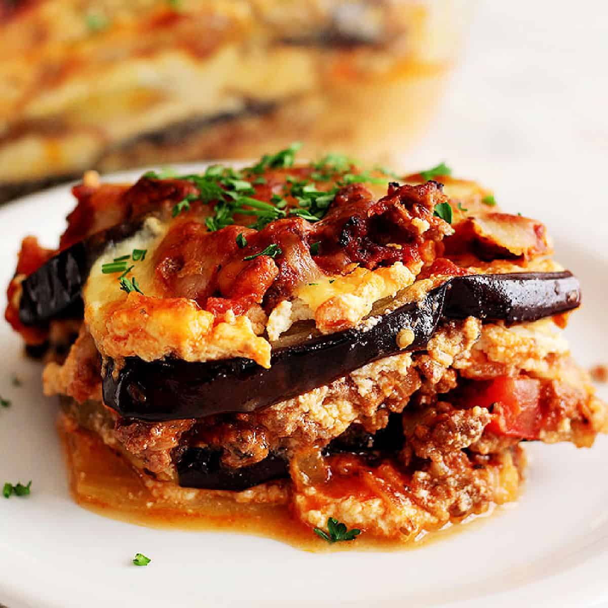 This easy eggplant lasagna recipe is cheesy, delicious and perfect for a weeknight dinner. It's made without the noodles so it's gluten free and low carb.
