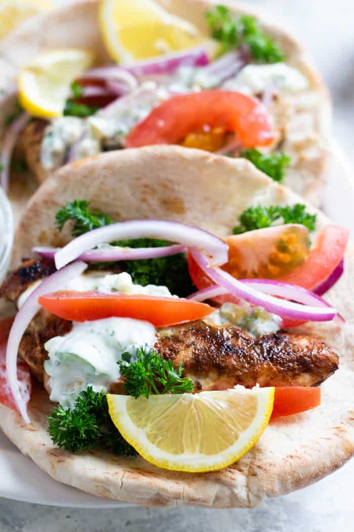 Chicken gyro on a pita with tzatziki and veggies.