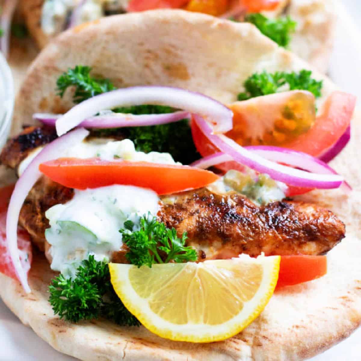 This chicken gyro recipe is easy and exceptionally delicious. The marinade makes the chicken extra flavorful and juicy. Stuff it into a pita with fresh veggies and homemade tzatziki for a fabulous Greek deliciousness!