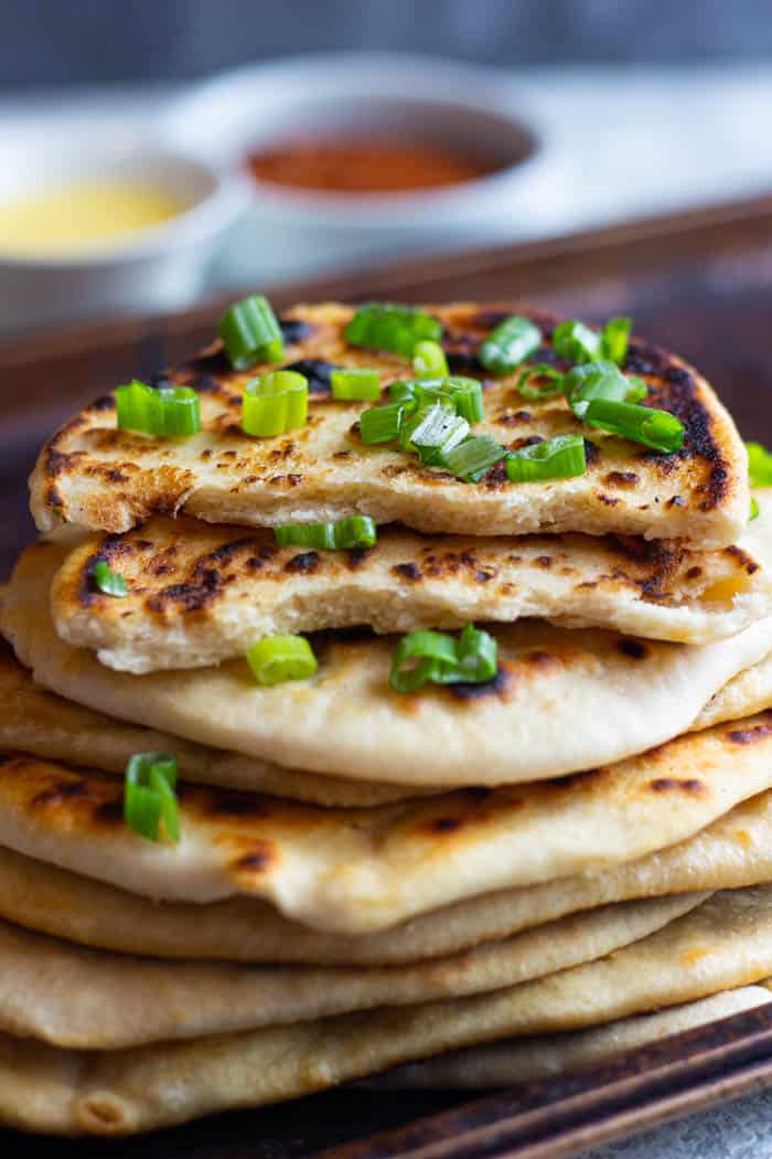 Stack naan on top of each other to keep them warm.