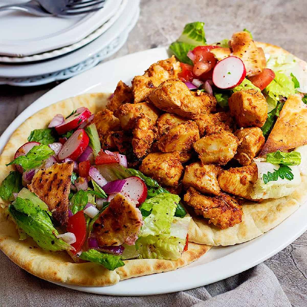 Shish Tawook is a Lebanese chicken dish that's simple yet so delicious. Tender chicken marinated in yogurt, lemon and garlic makes one delicious meal for the family. 
