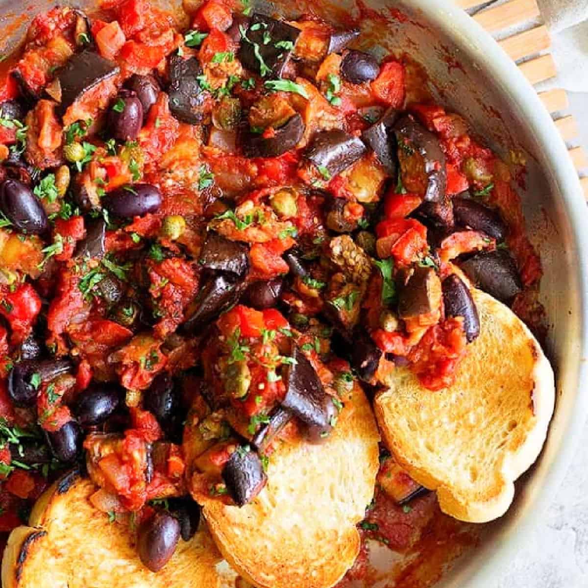Eggplant caponata is an easy recipe that's full of flavor. This vegetarian eggplant recipe is made with fresh vegetables and is very simple to make. 
