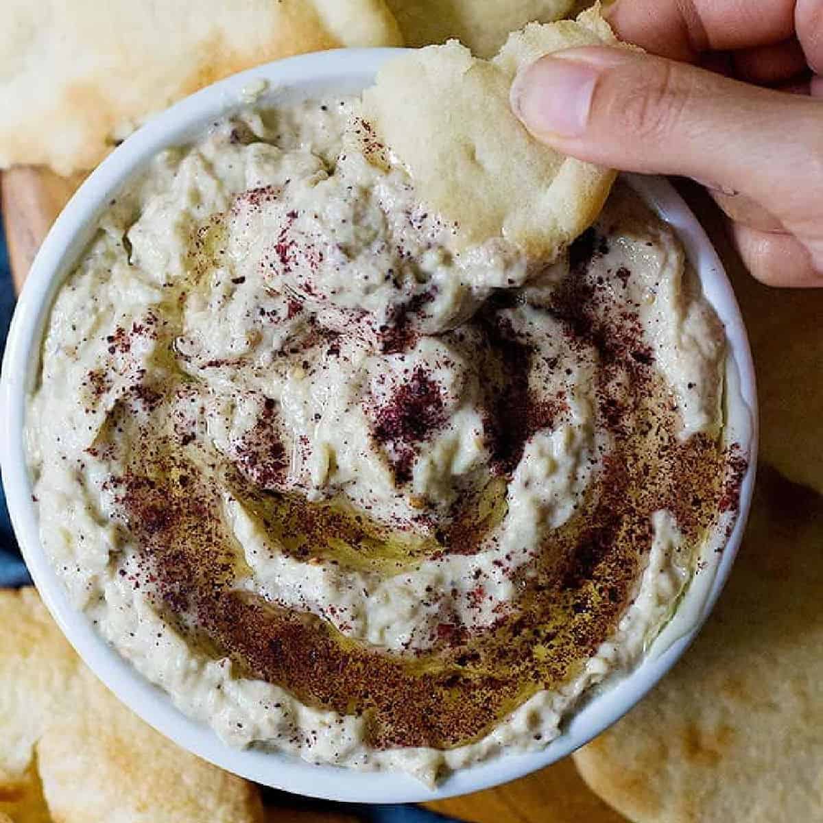 Baba ganoush is a classic middle eastern eggplant recipe. Charred eggplant mixed with tahini makes a delicious dip that you can make in 30 minutes!