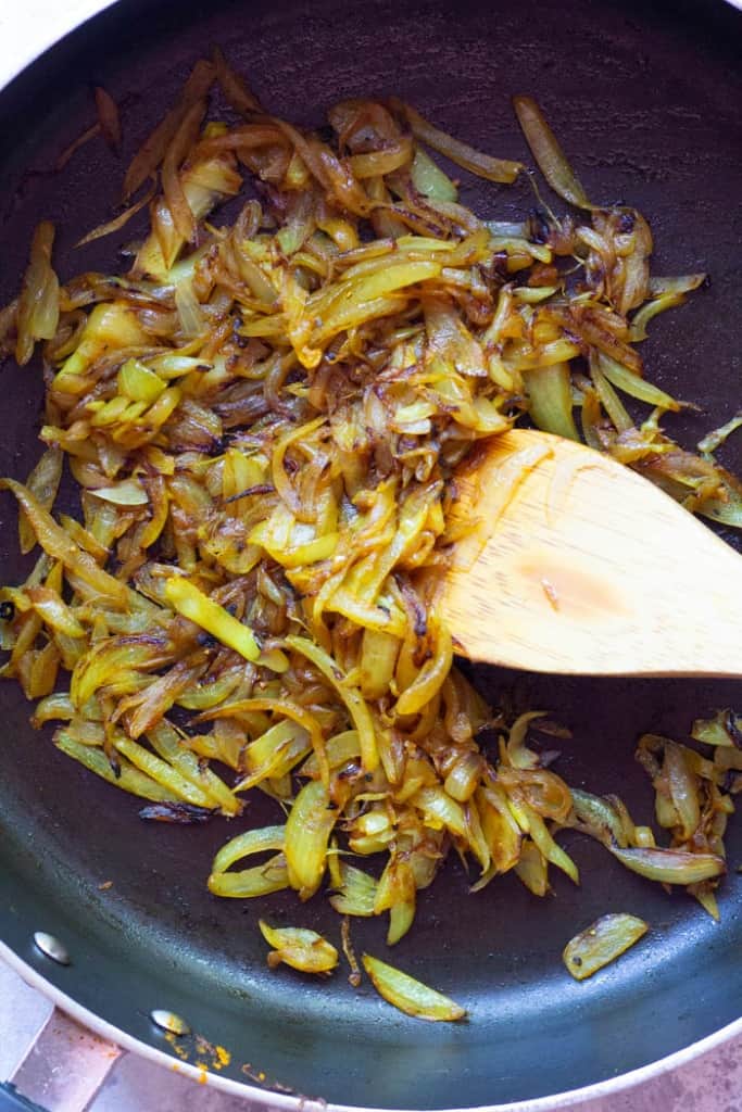 Fry the onions until golden brown.