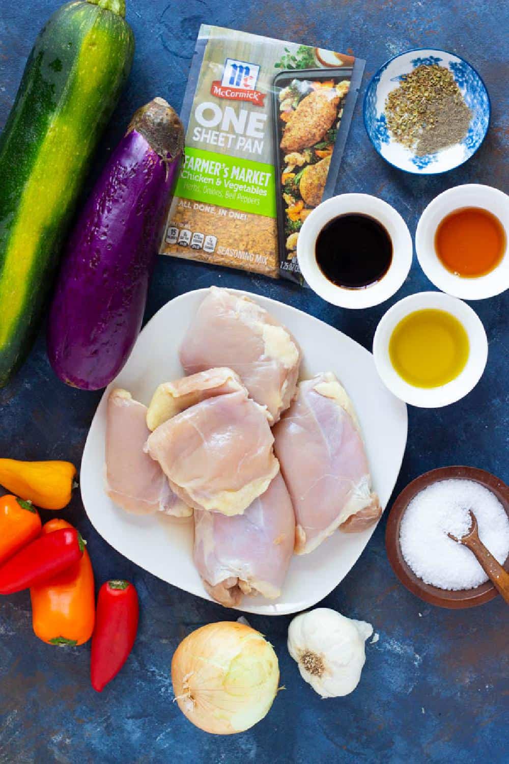 To make sheet pan honey balsamic chicken you need chicken, balsamic vinegar, olive oil, honey, eggplant, zucchini, peppers, spices and salt.