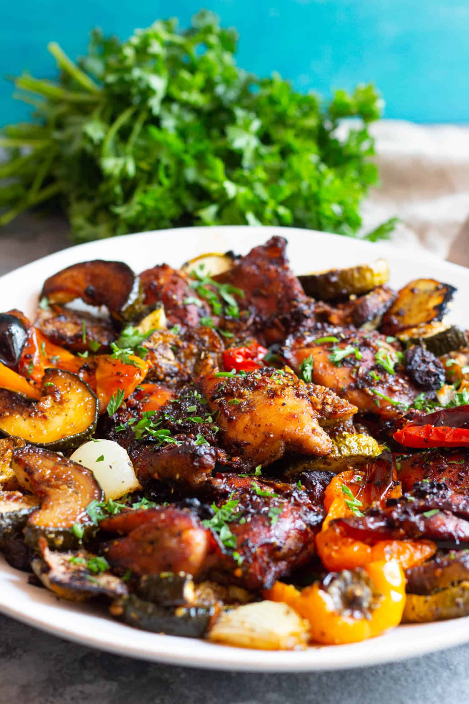 Top the chicken with some chopped parsley and serve.