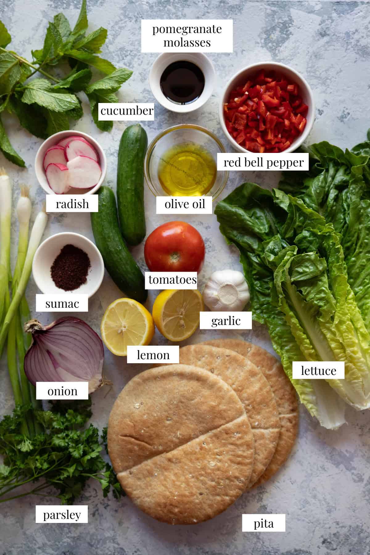 To make fattoush salad you need, tomatoes, lemon, garlic, pomegranate molasses, pita, lettuce, onion, parsley, sumac, olive oil, radish and red bell pepper