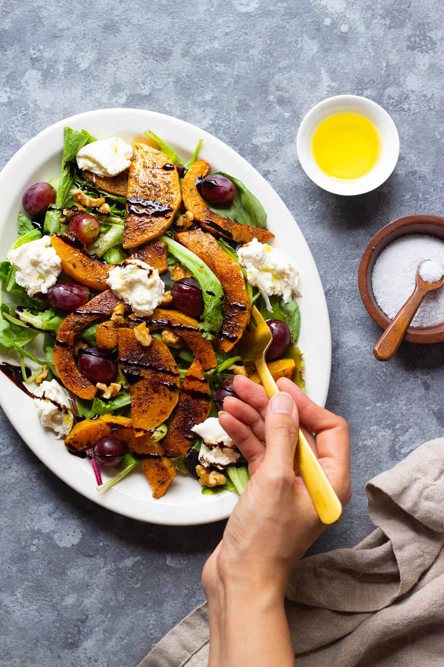 Roasted butternut squash salad topped with burrata and balsamic vinaigrette. 