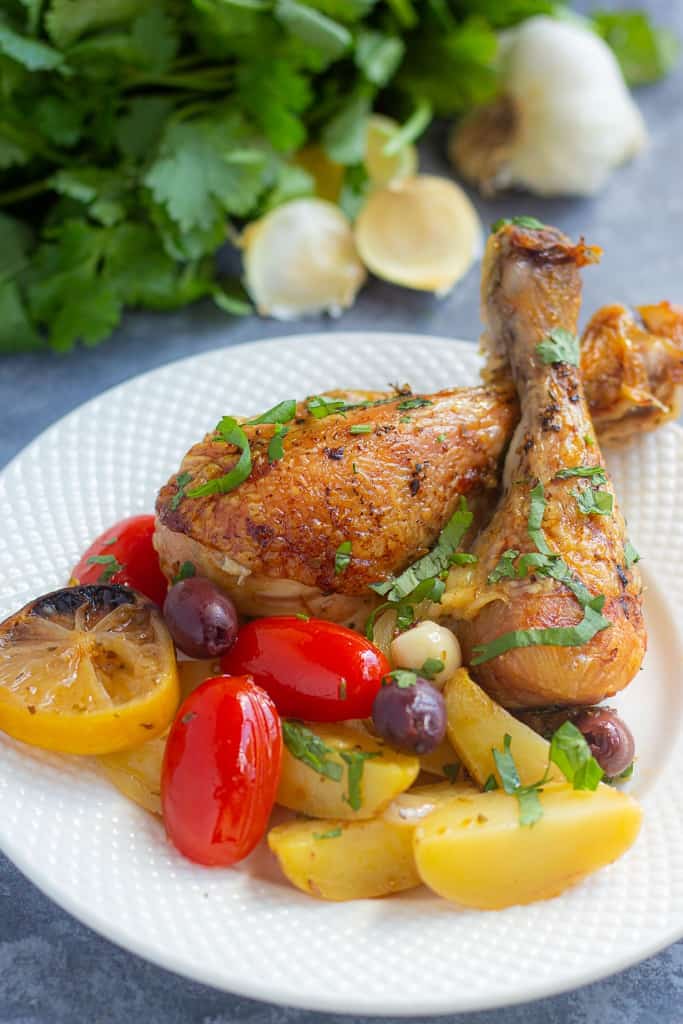 Serve chicken and potatoes on a plate. 