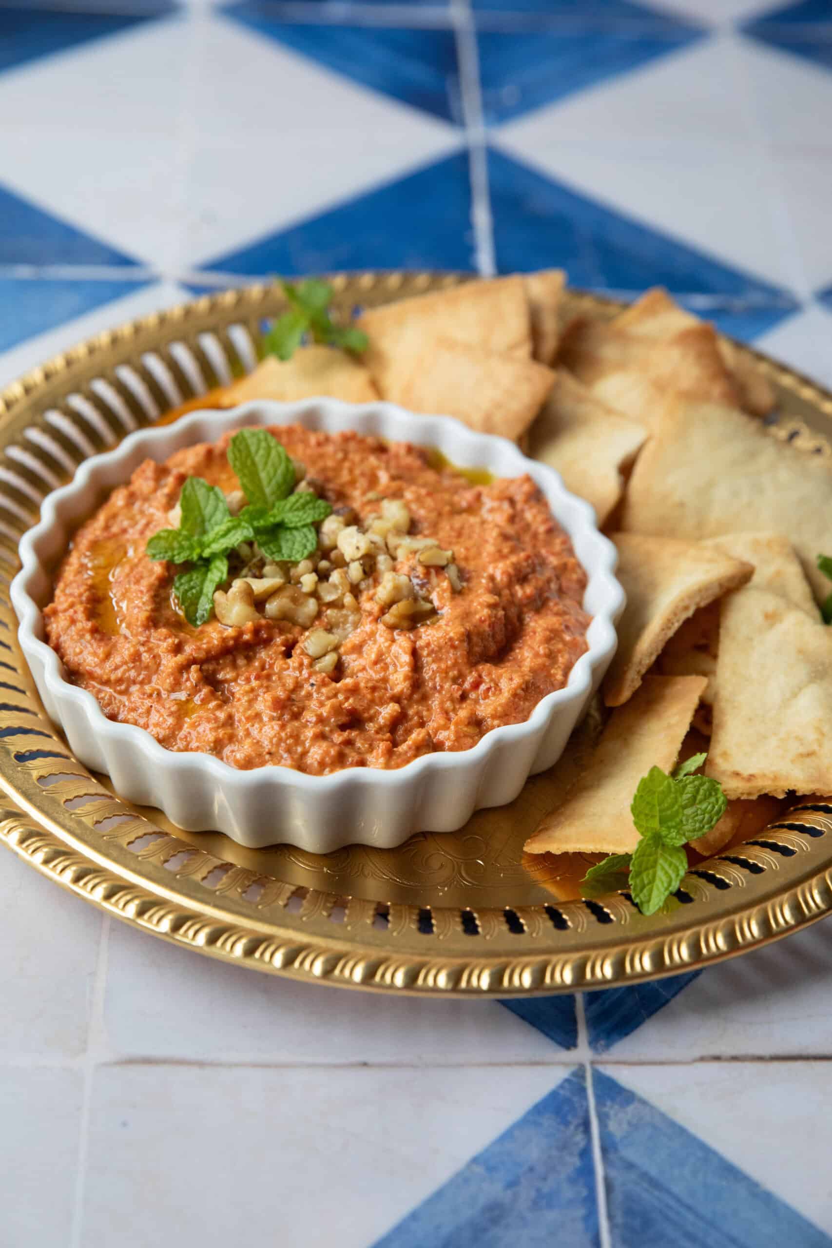 Roasted red pepper dip topped with walnuts and green onion