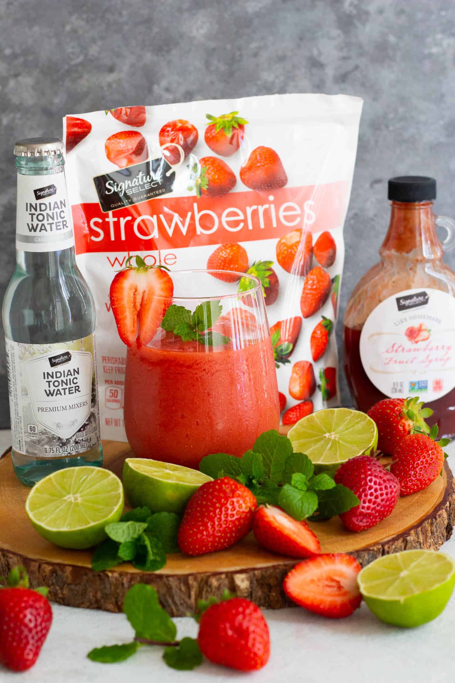Virgin strawberry daiquiri with ingredients.