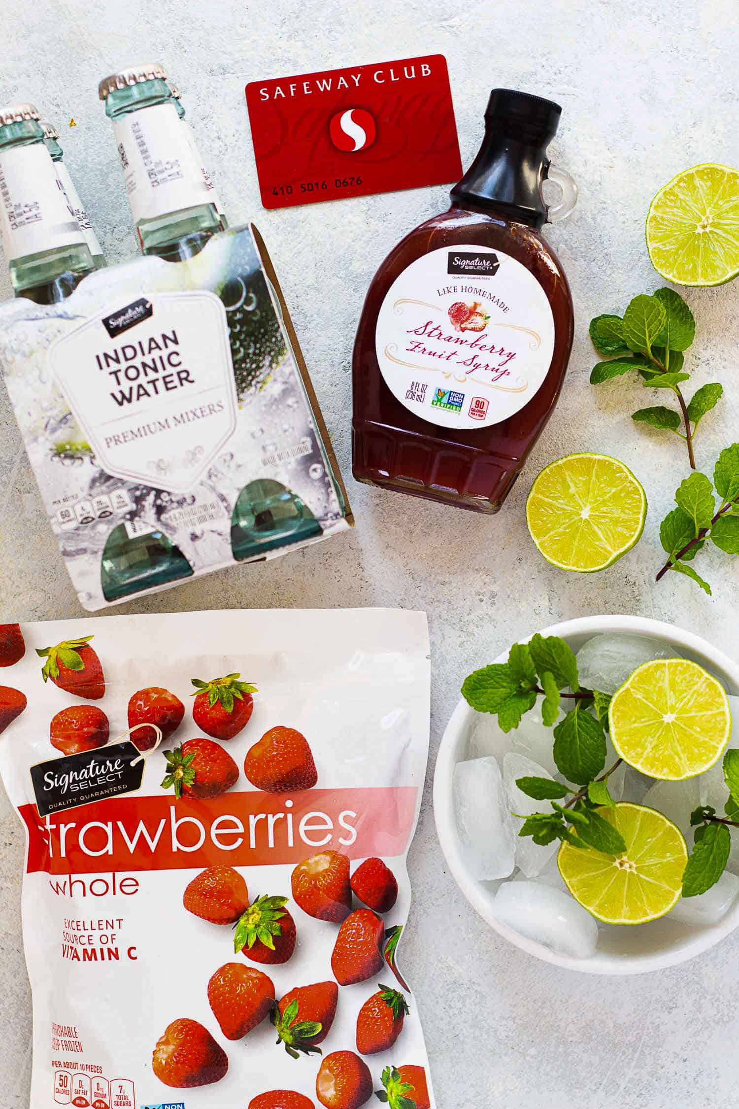 To make this recipe you need strawberry fruit syrup, frozen strawberries, lime, ice and tonic water.