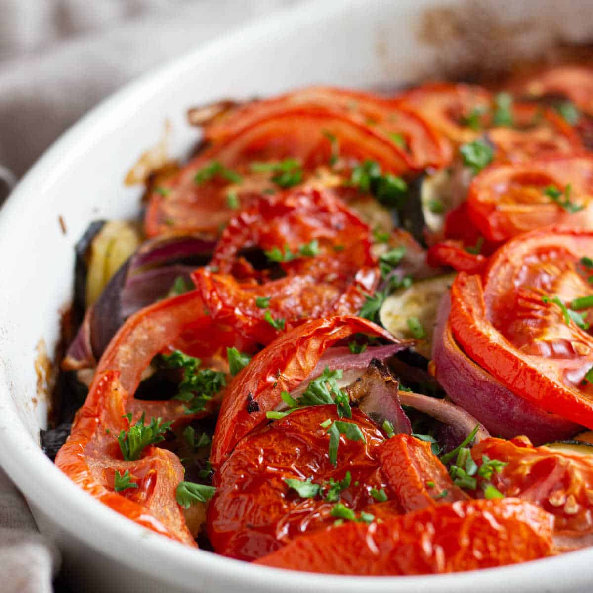 Briam is a Greek roasted vegetables dish cooked in olive oil. This easy and delicious recipe is made with just a few ingredients and is vegan, low carb and gluten free.
