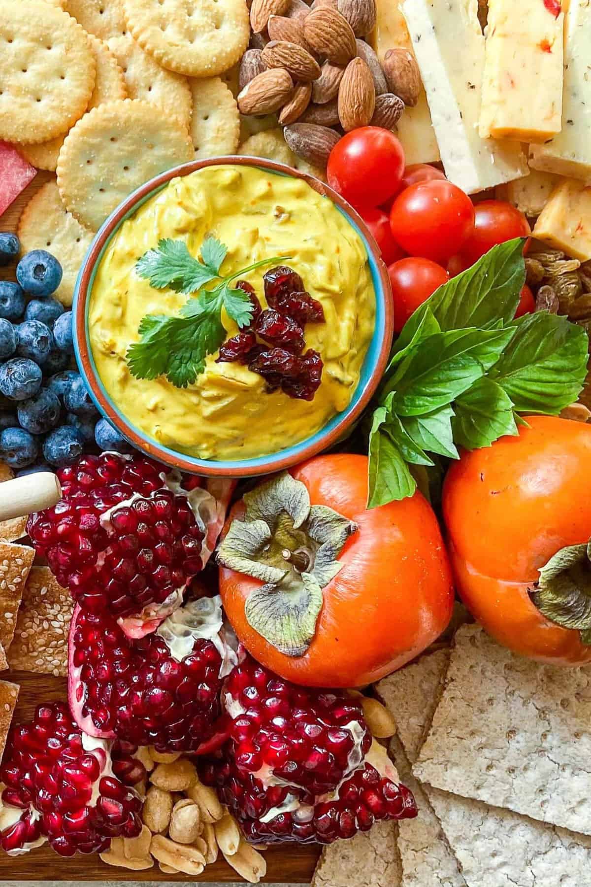 Yalda board also has pomegranates, crackers, cheese and nuts.