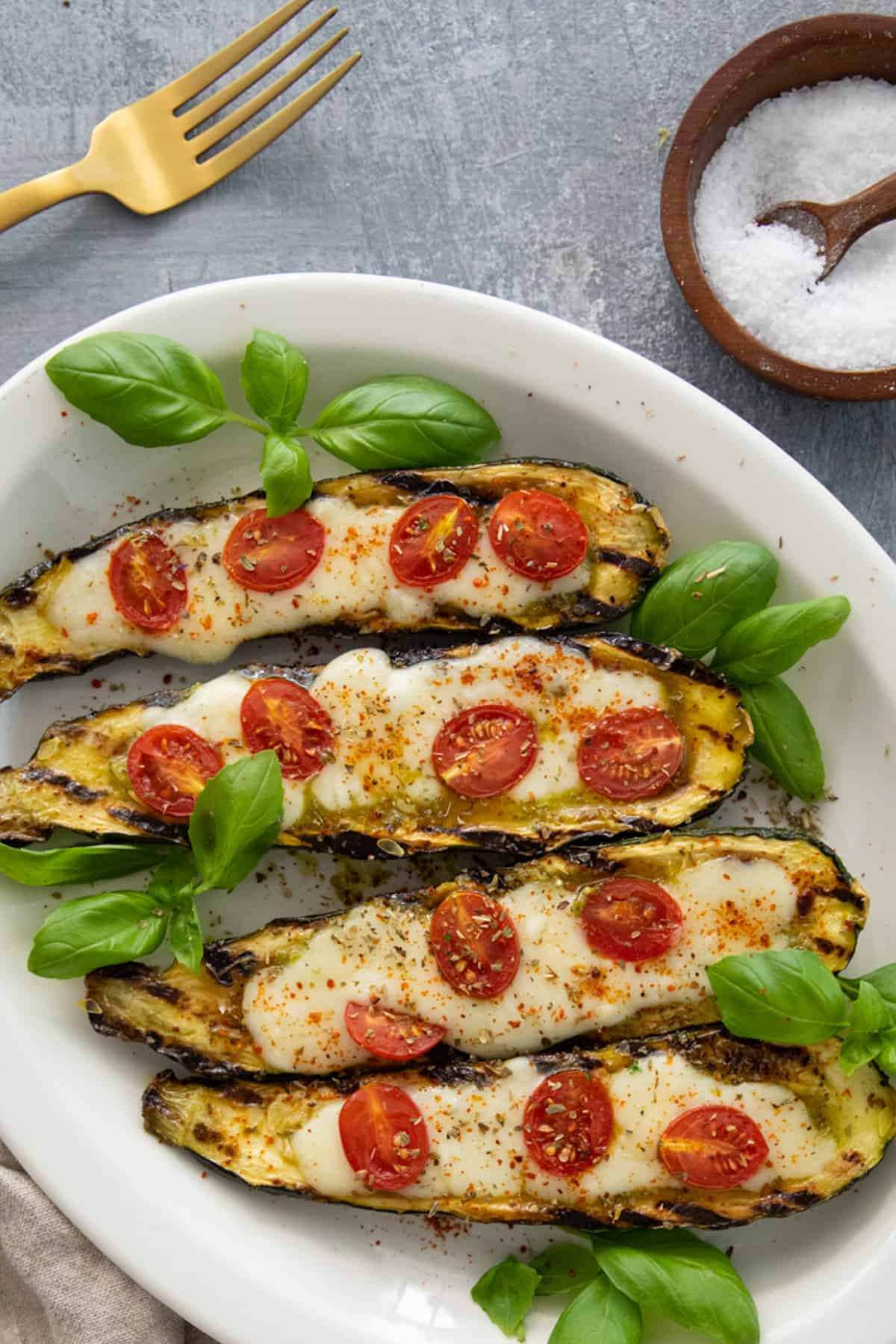 Top the stuffed zucchini boats with fresh basil and crushed red pepper. 