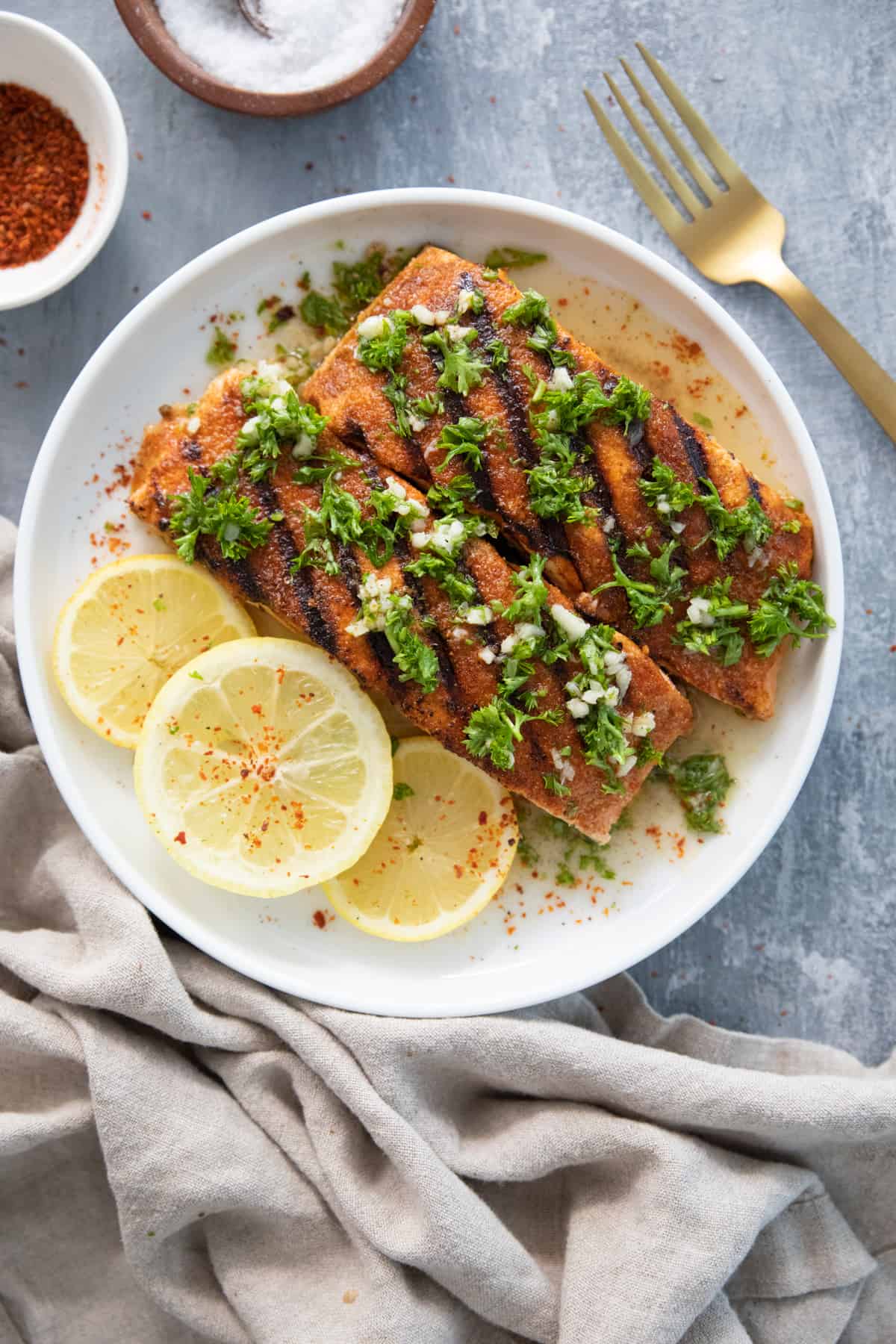 Grilled salmon on a white plate. 