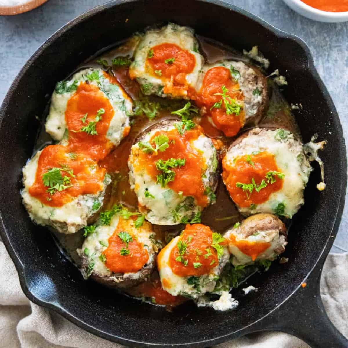 These delicious grilled stuffed mushrooms are ready in 30 minutes. Stuffed with 3 types of cheese and spinach, this is a crowd pleasing appetizer!
