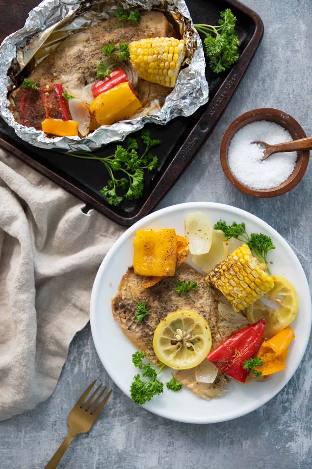 grilled tilapia and vegetables in foil. 