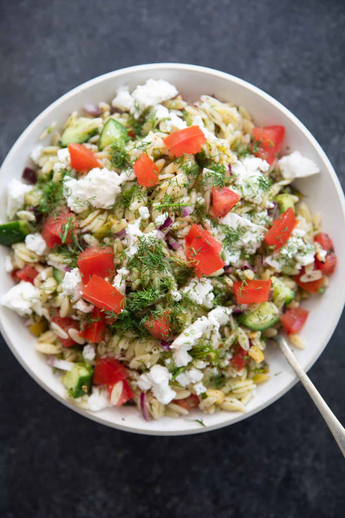 You can add tomatoes to the orzo salad if desired.