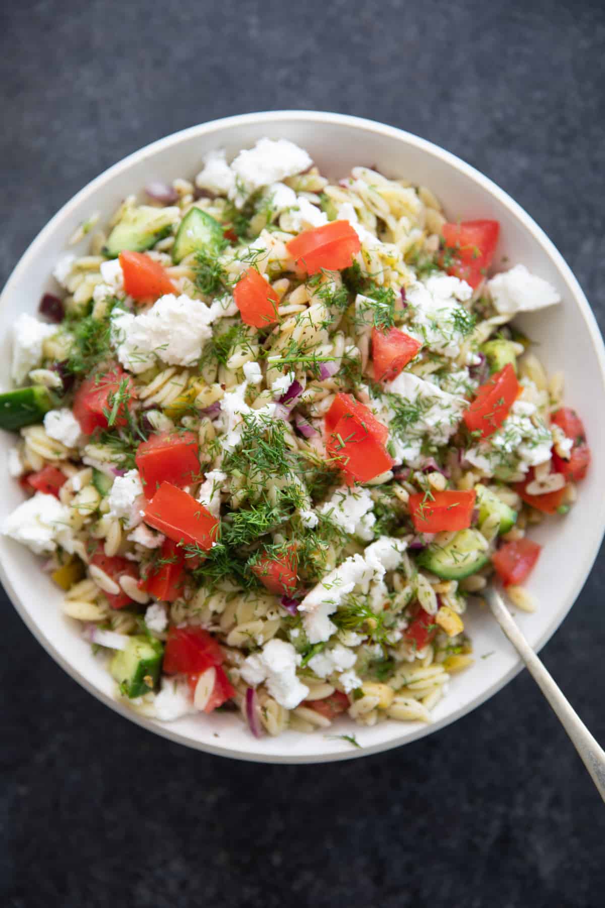 You can add tomatoes to the orzo salad if desired. 