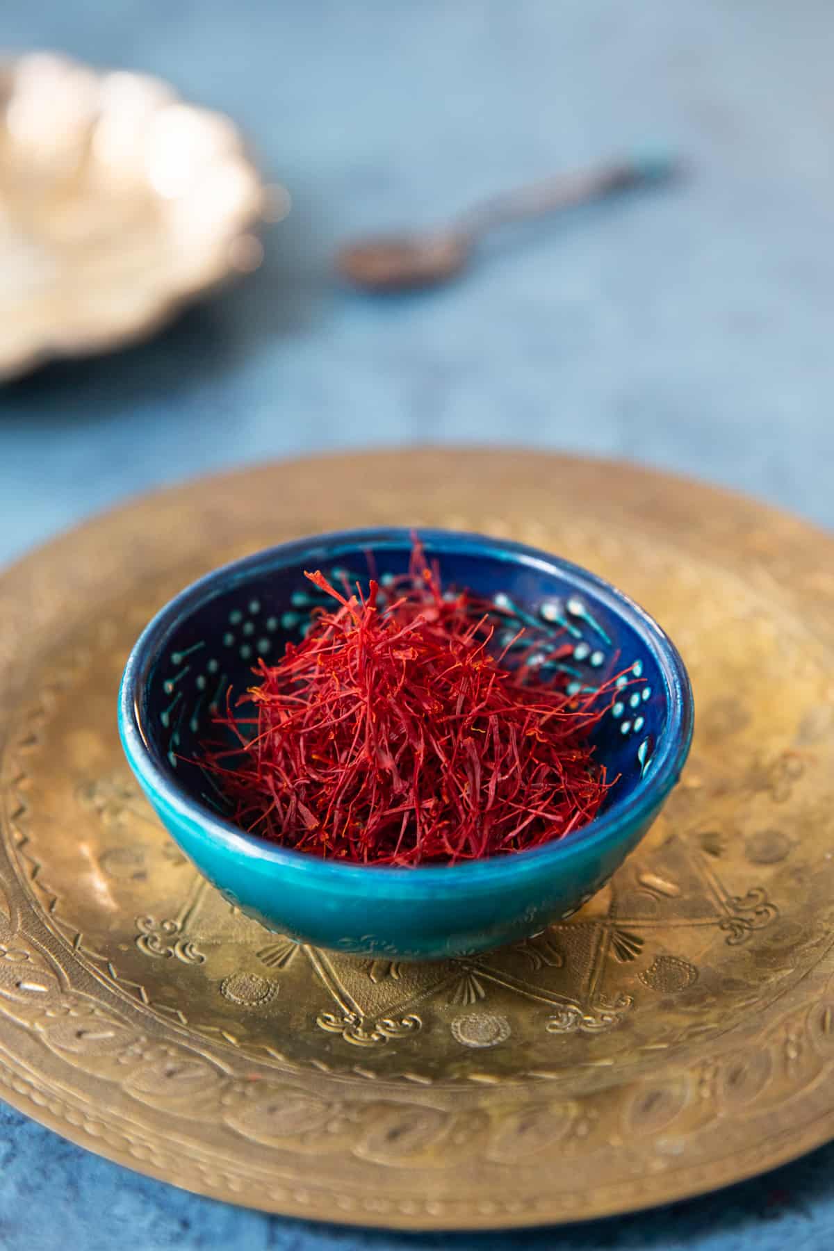 Saffron in a bowl on a plate. 