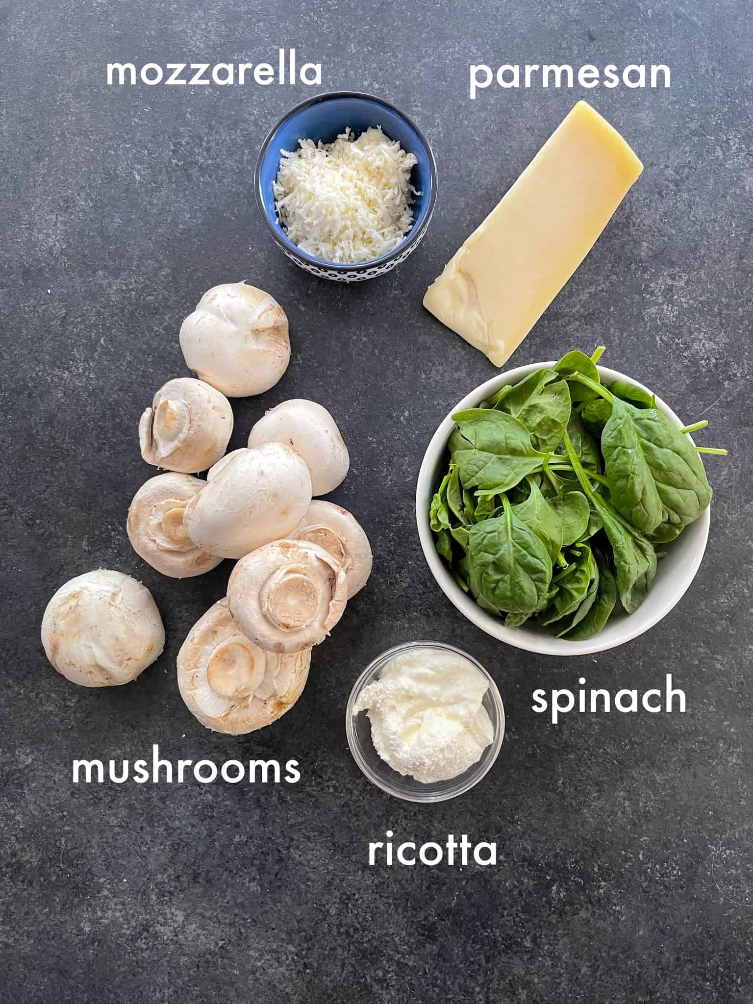 To make this recipe you need mushrooms, parmesan, mozzarella, ricotta and spinach. 