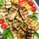 Grilled zucchini with tahini yogurt sauce.