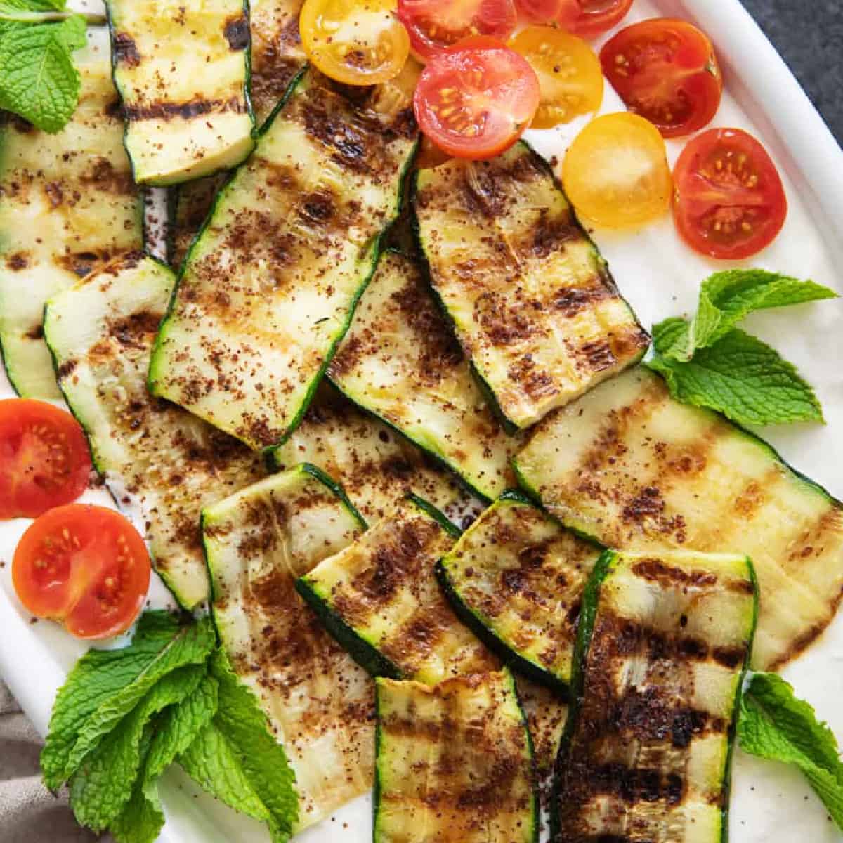 Grilled zucchini with tahini yogurt sauce.