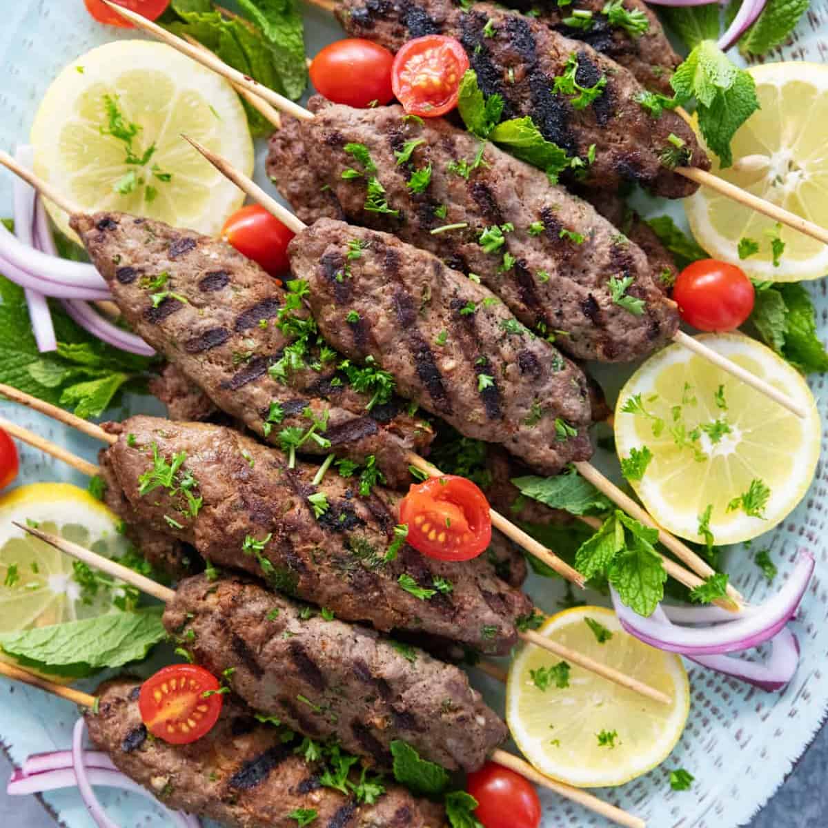This kofta kebab recipe is a cornerstone of Middle Eastern cuisine. Learn how to make juicy kofta kebab on the grill and serve with pita, veggies and tahini sauce.

