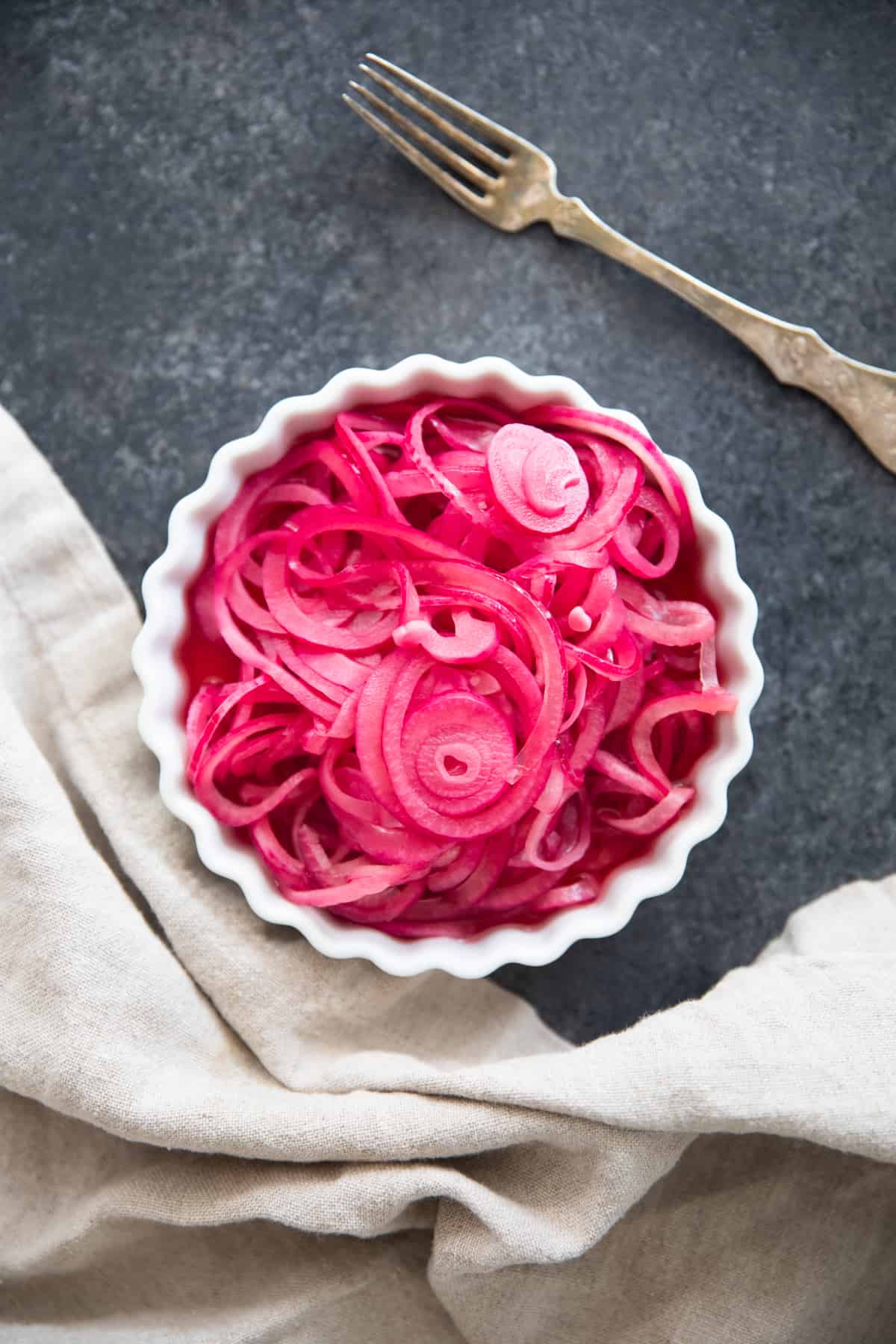 overhead shot of pickled red onions. 