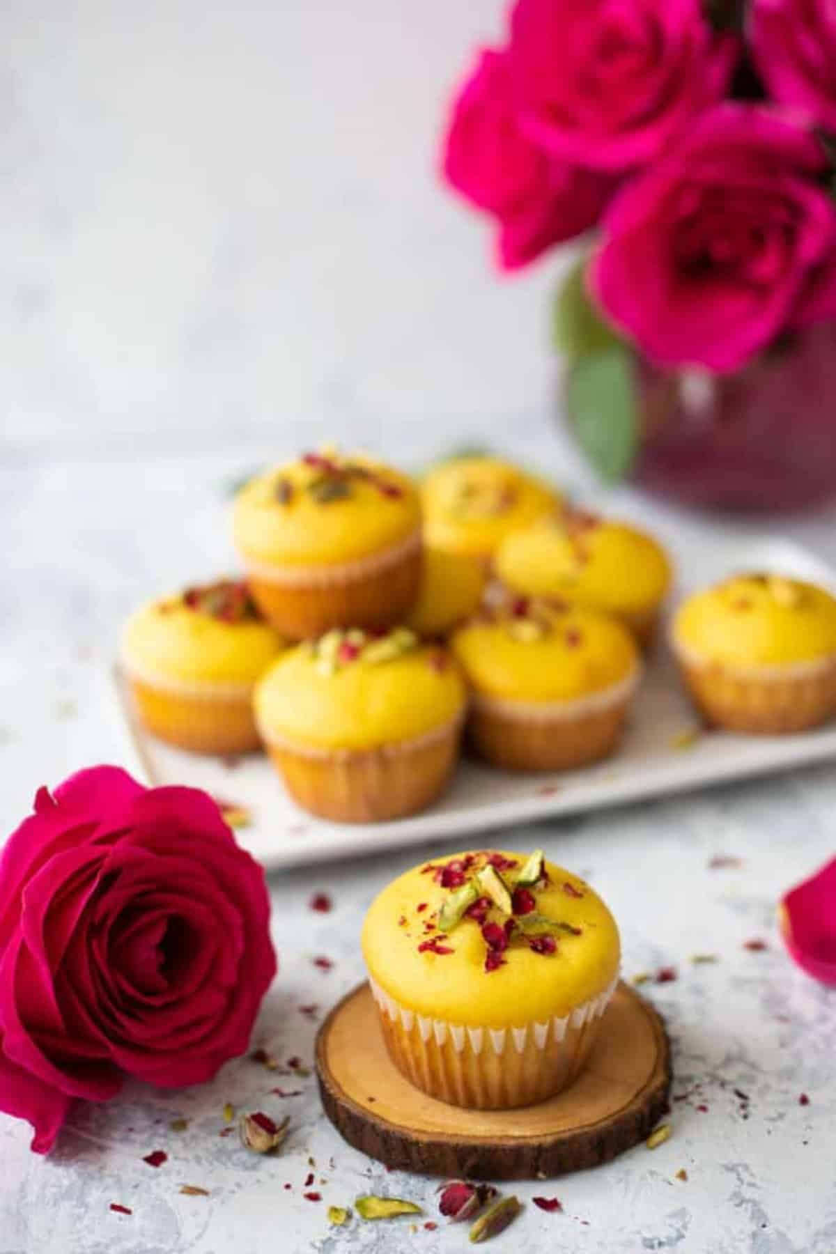 Closeup shot of saffron and rose muffins.