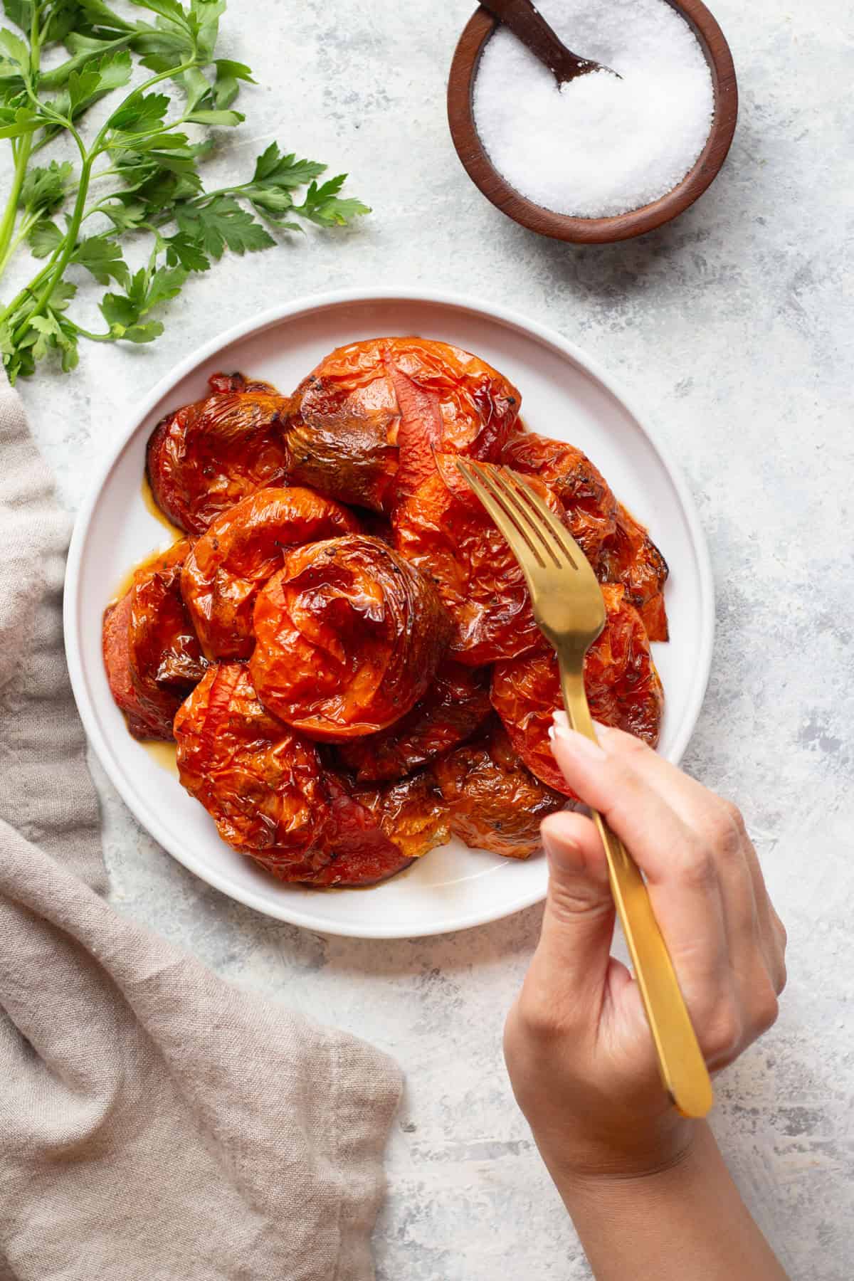 Oven roasted tomatoes are so easy to make and are delightfully delicious. Make them into pasta sauce, or simply serve with a crusty bread. However you serve these roasted tomatoes, they're going to be perfect.