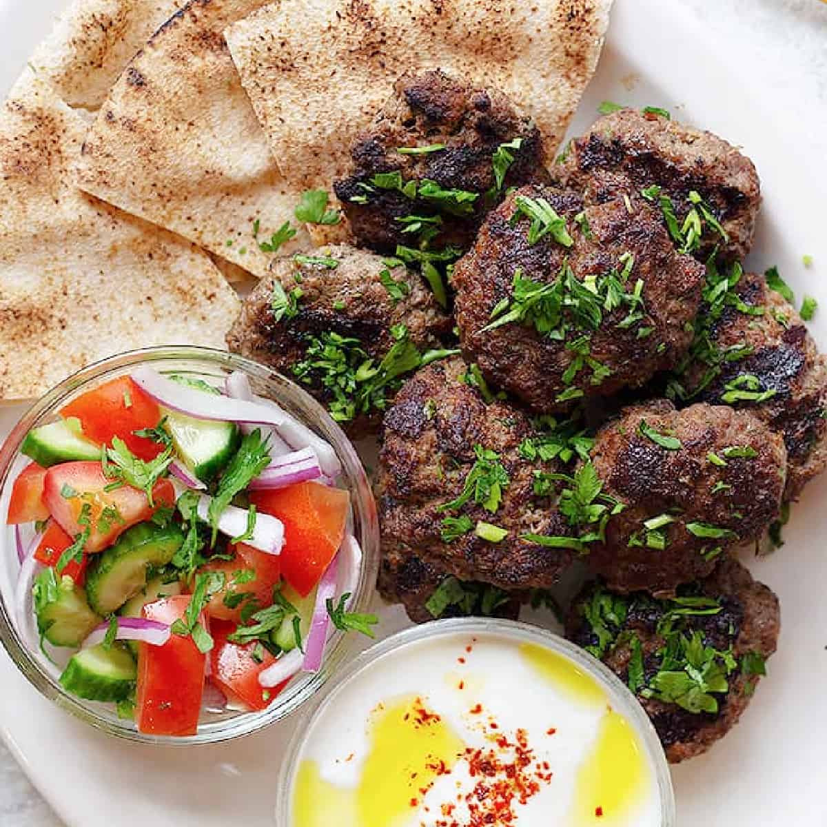 Kofta kebab is a classic Middle Eastern ground beef recipe that's packed with flavor. Learn how to make kofta kebab with my step by step tutorial and video. 

