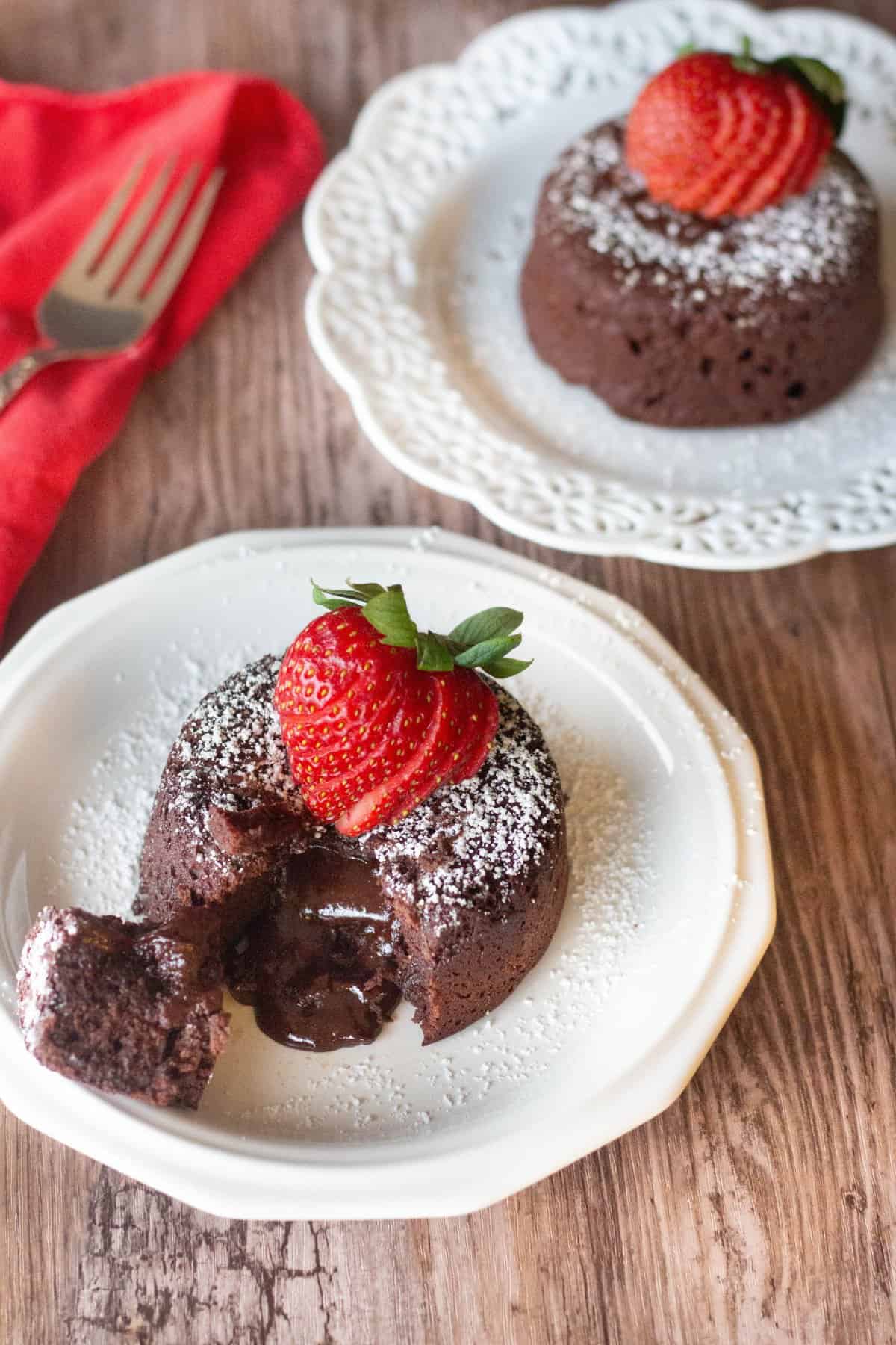 Molten chocolate lava cake made served with strawberries. 