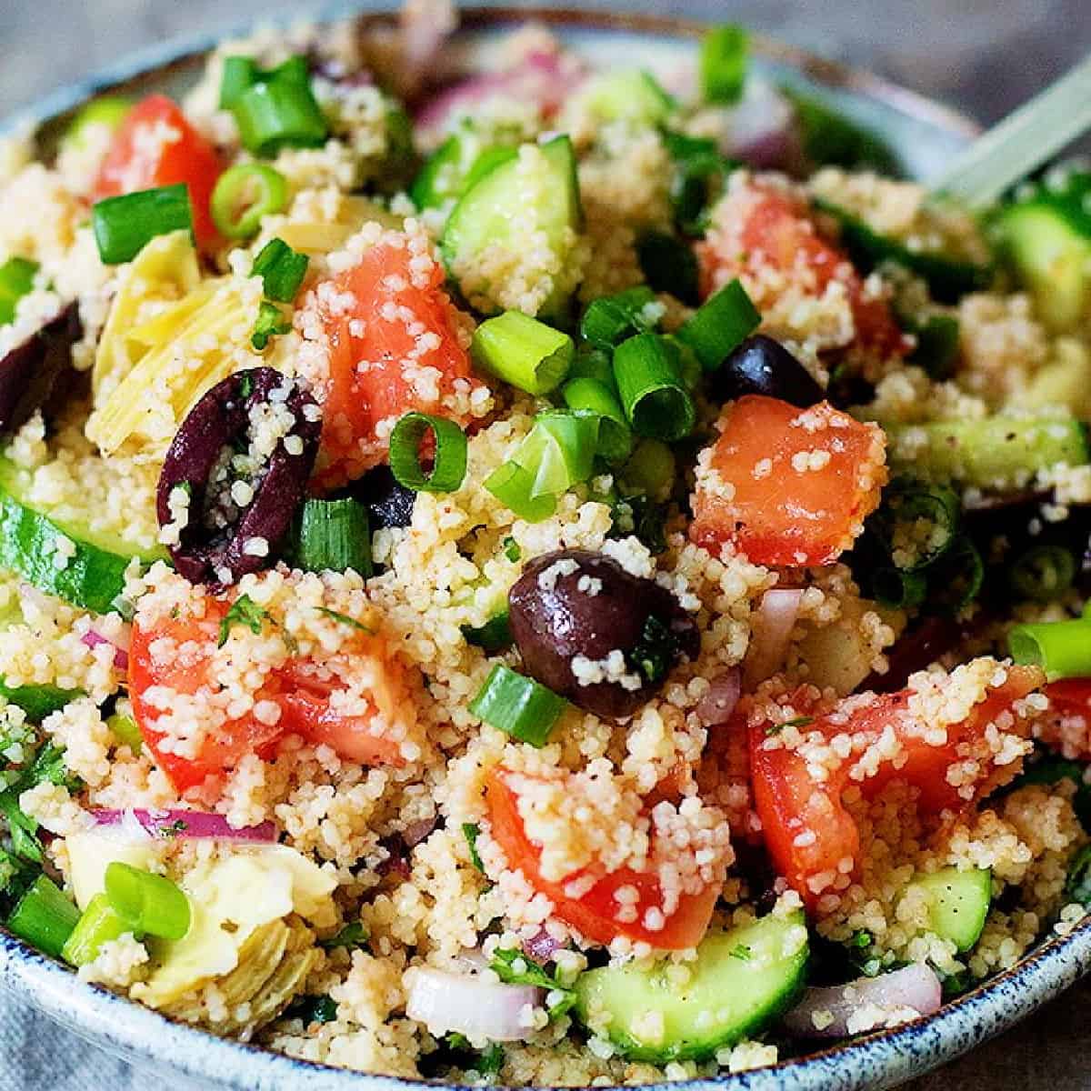 An easy couscous salad packed with Mediterranean flavors. This couscous salad recipe comes together in only 15 minutes and makes an amazing side dish.
