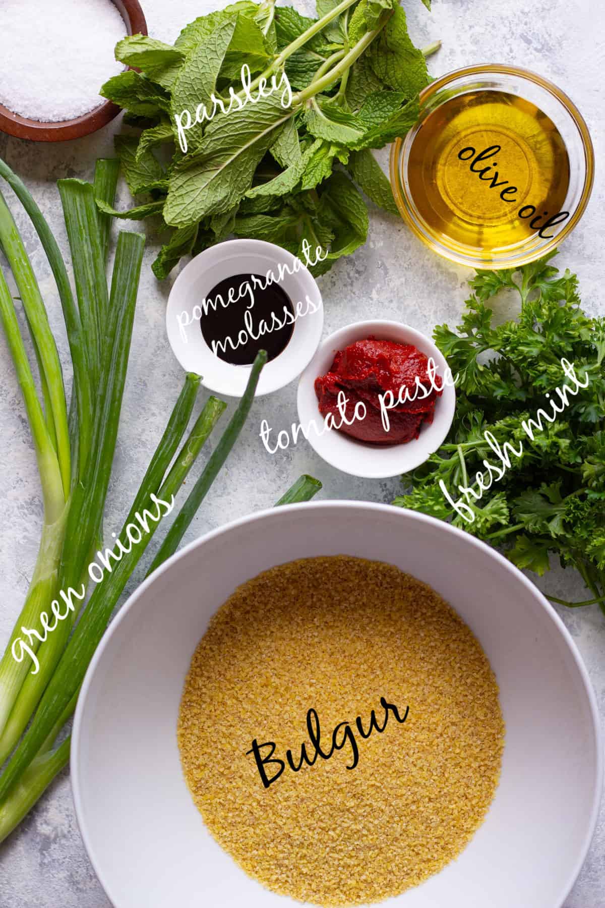 to make Turkish bulgur salad kisir your need bulgur, green onions, parsley and mint. You also need tomato paste, pomegranate molasses and olive oil .
