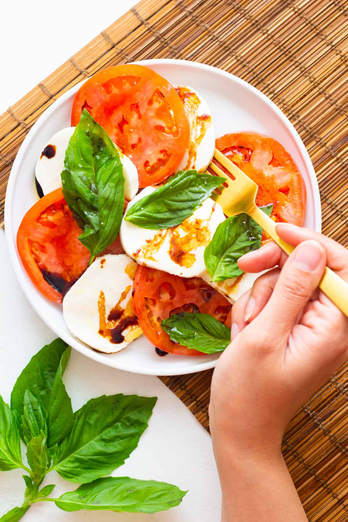 This caprese salad recipe is an Italian classic made with fresh mozzarella and juicy tomatoes. It takes only 10 minutes to make this salad and fresh and quality ingredients is the key to its great flavor.  
