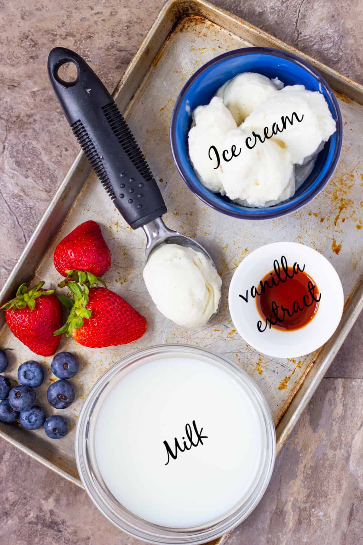 For this milkshake recipe you need milk, ice cream, vanilla extract and berries