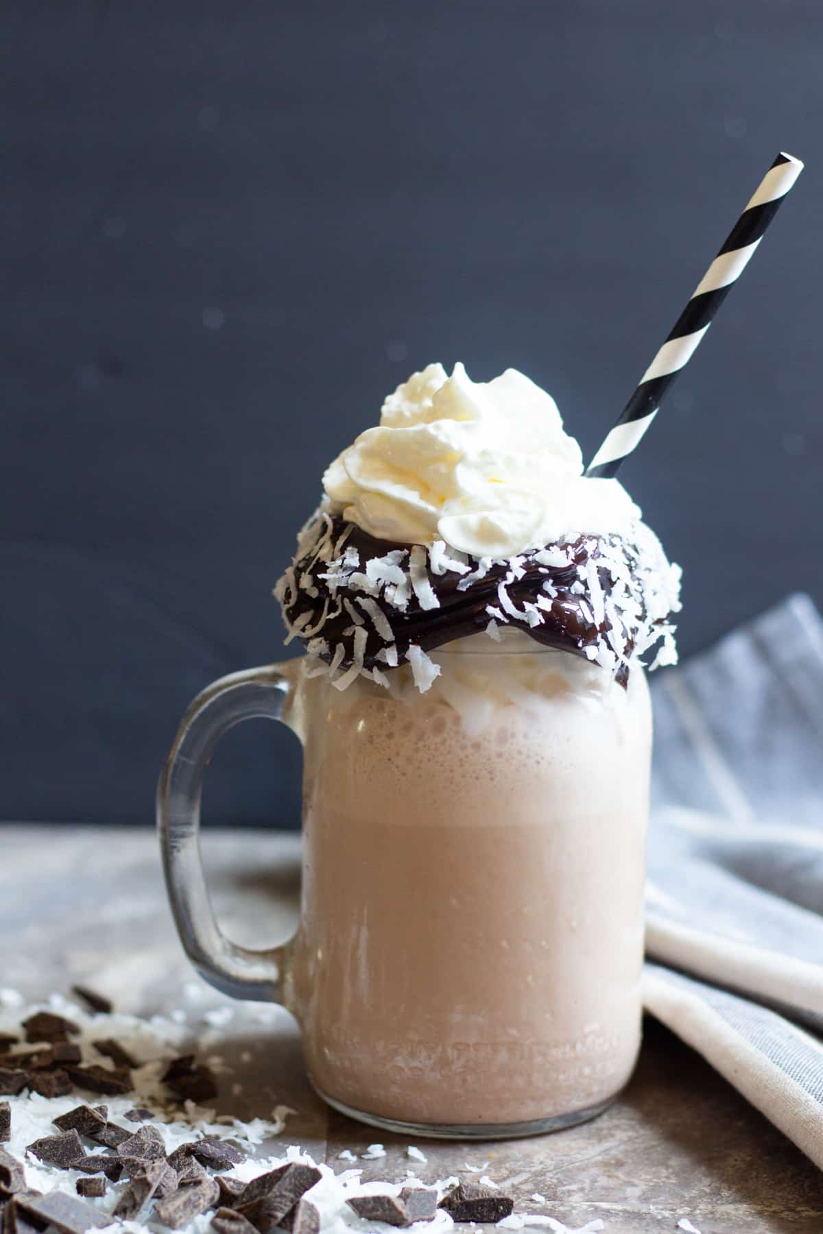 coconut chocolate milkshake with a straw