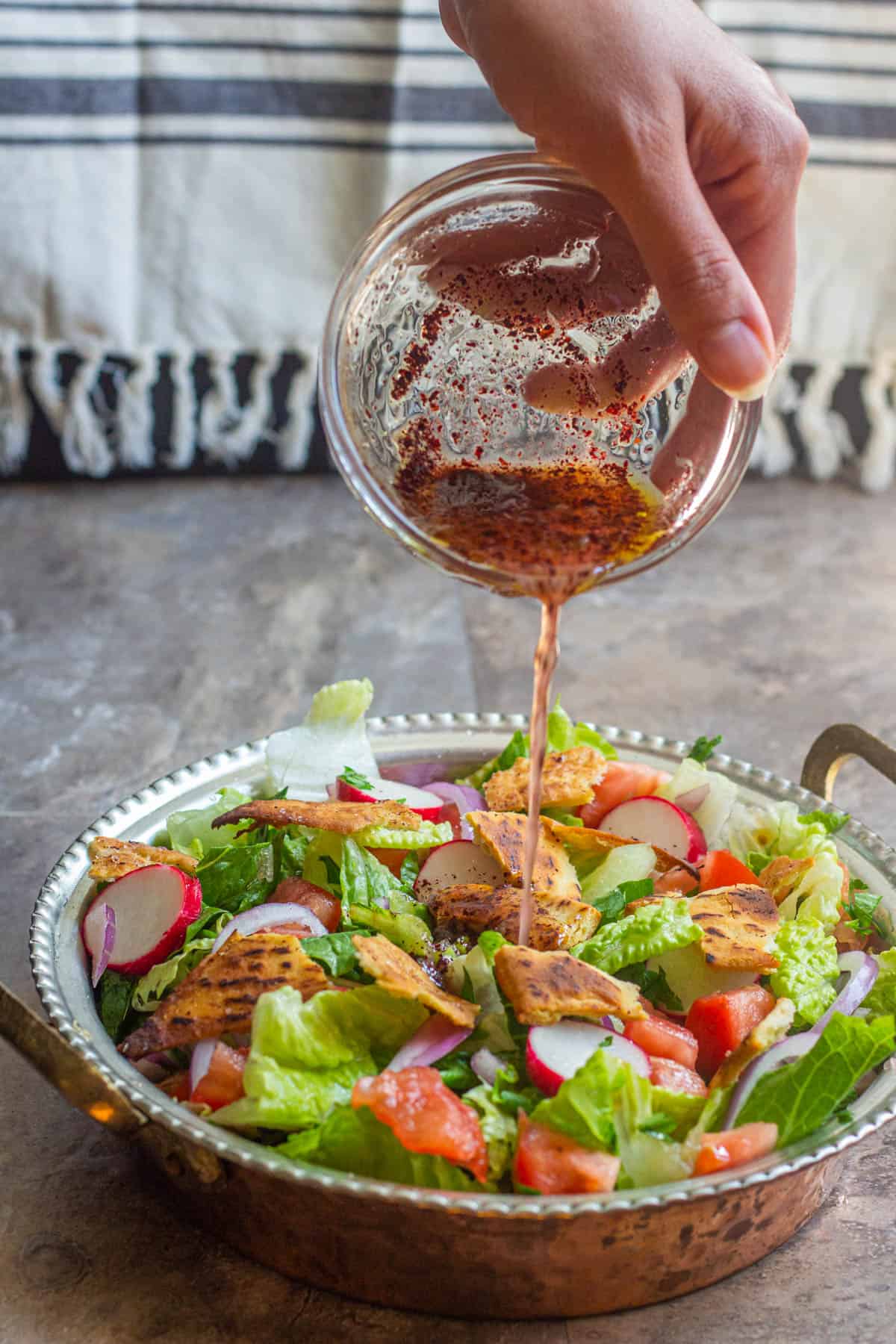 Pour the sauce over the salad and toss to combine. 