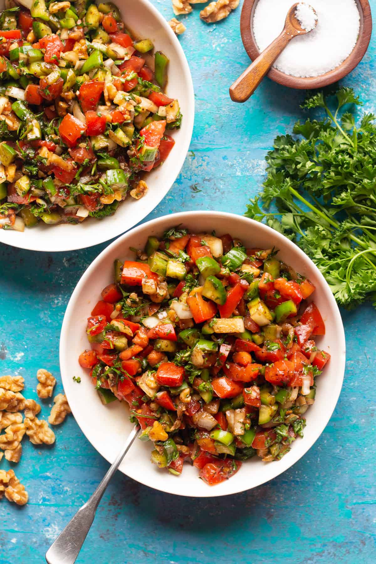 Turkish tomato salad made with fresh, plump tomatoes, cucumbers and crunchy walnuts is absolutely delicious. Flavored with pomegranate molasses and ready in 15 minutes, this is the perfect side dish.
