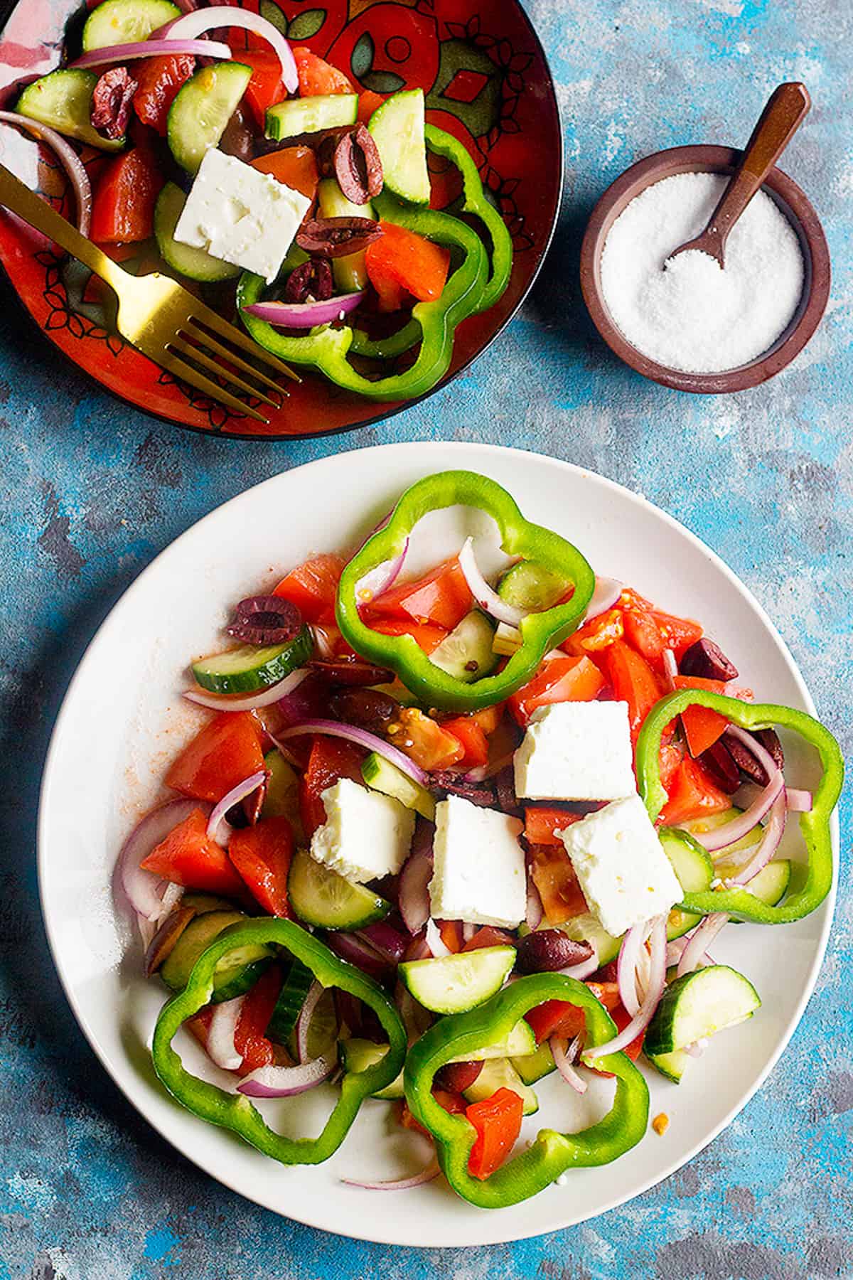 Learn how to make traditional Greek salad recipe with only a few ingredients. This easy and simple summer salad comes together in no time!