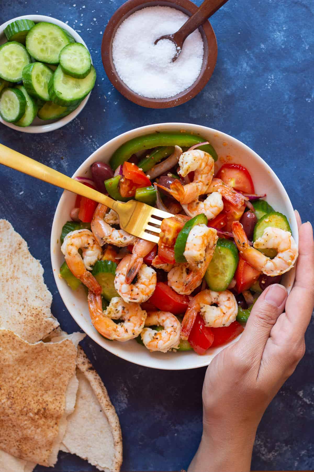 You can serve this Greek style shrimp salad with pita bread or pita chips.