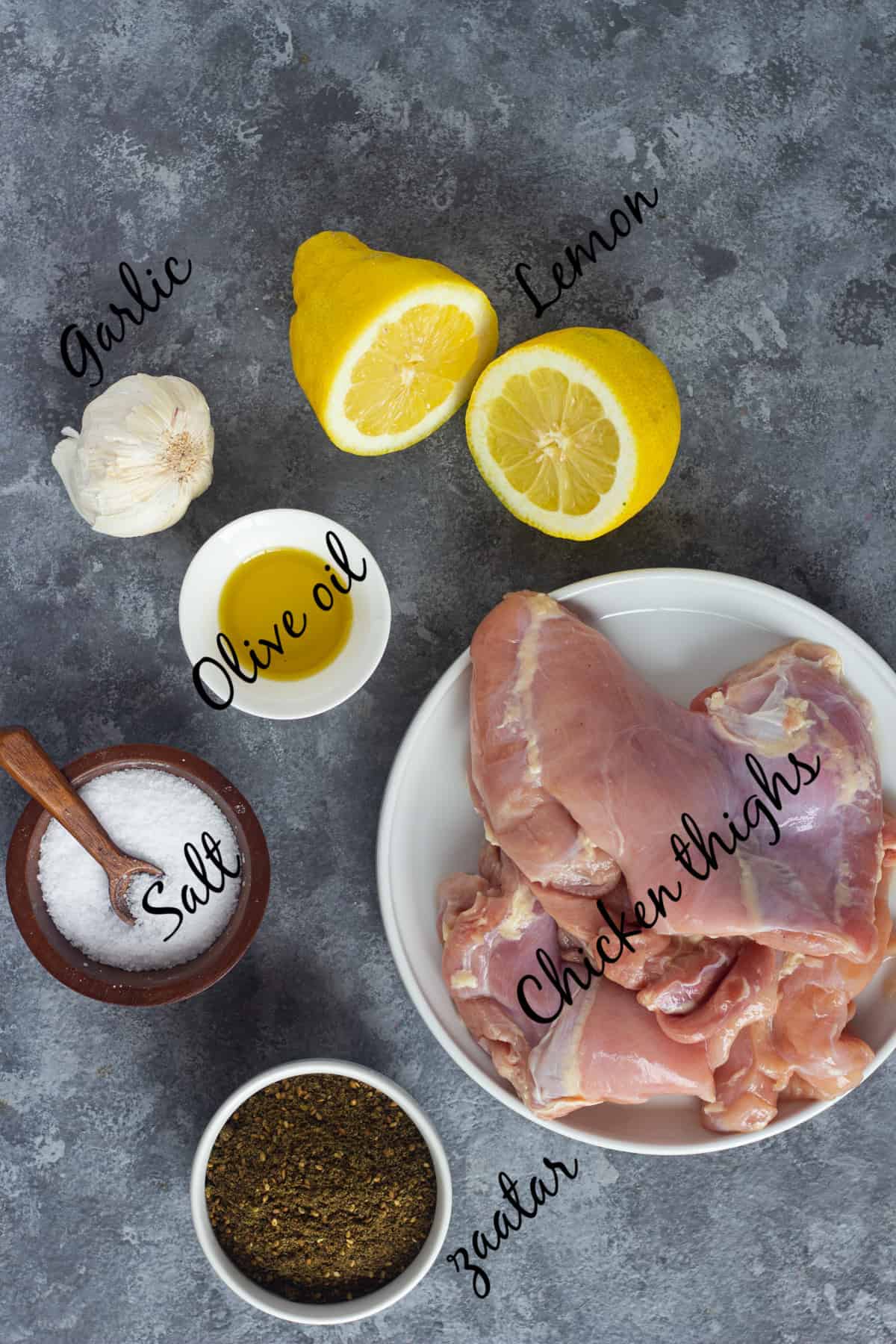 To make this recipe you need chicken thighs, olive oil, salt, zaatar, garlic and lemon juice.