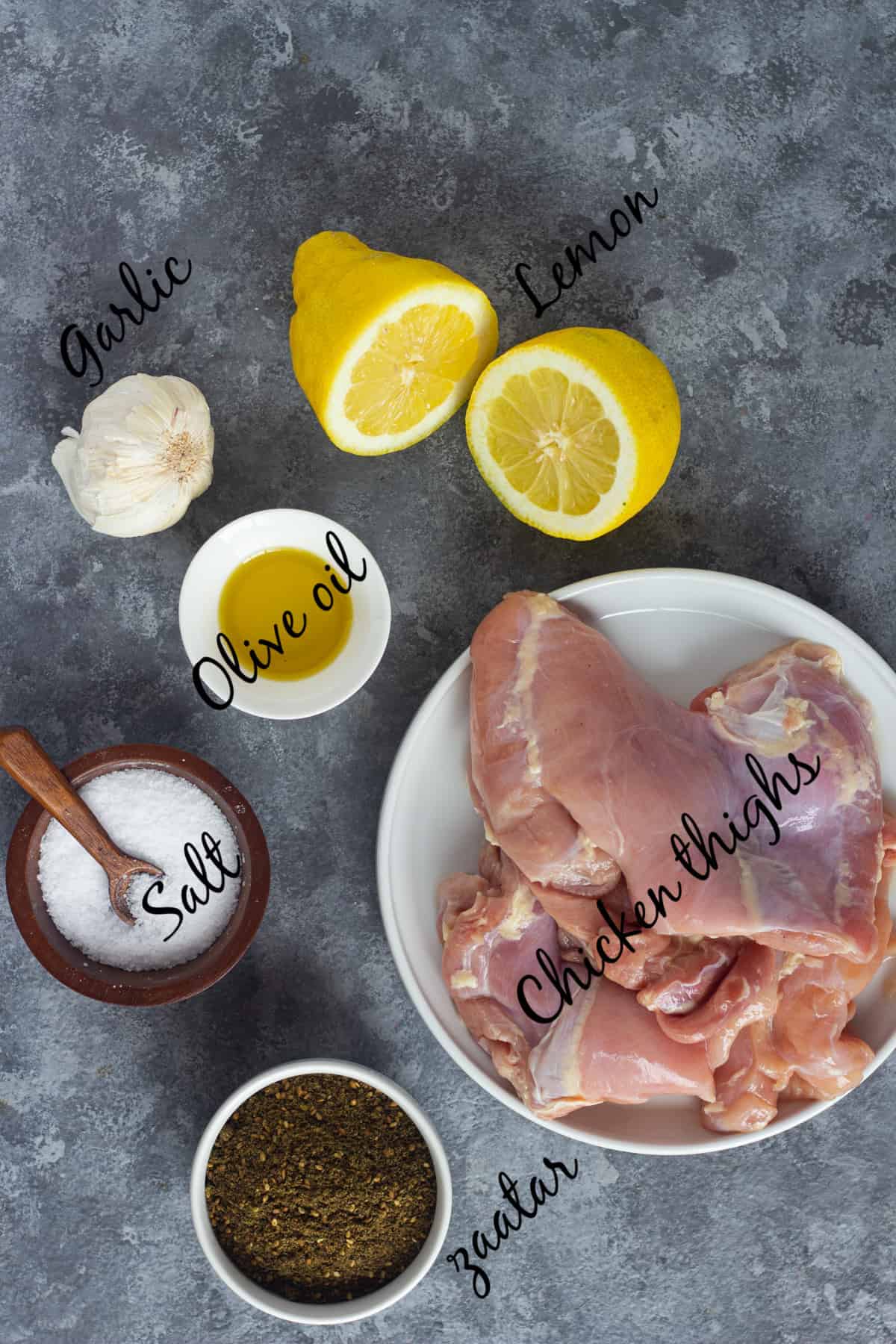 To make this recipe you need chicken thighs, olive oil, salt, zaatar, garlic and lemon juice. 