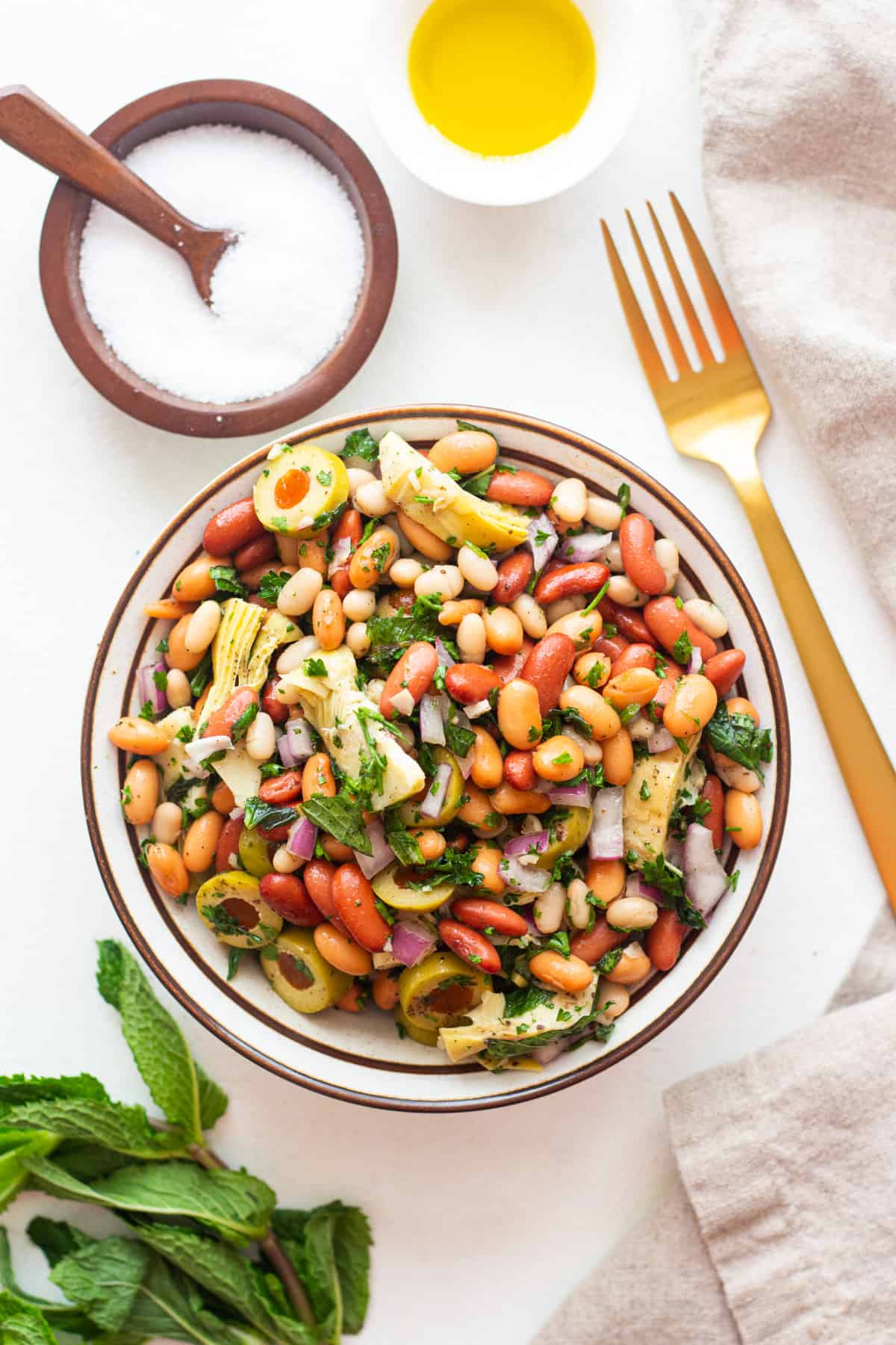 An easy three bean salad recipe with a Mediterranean twist. This protein-packed vegan salad is perfect for meal prep or as a side dish. Make sure to watch the video for step-by-step instructions.