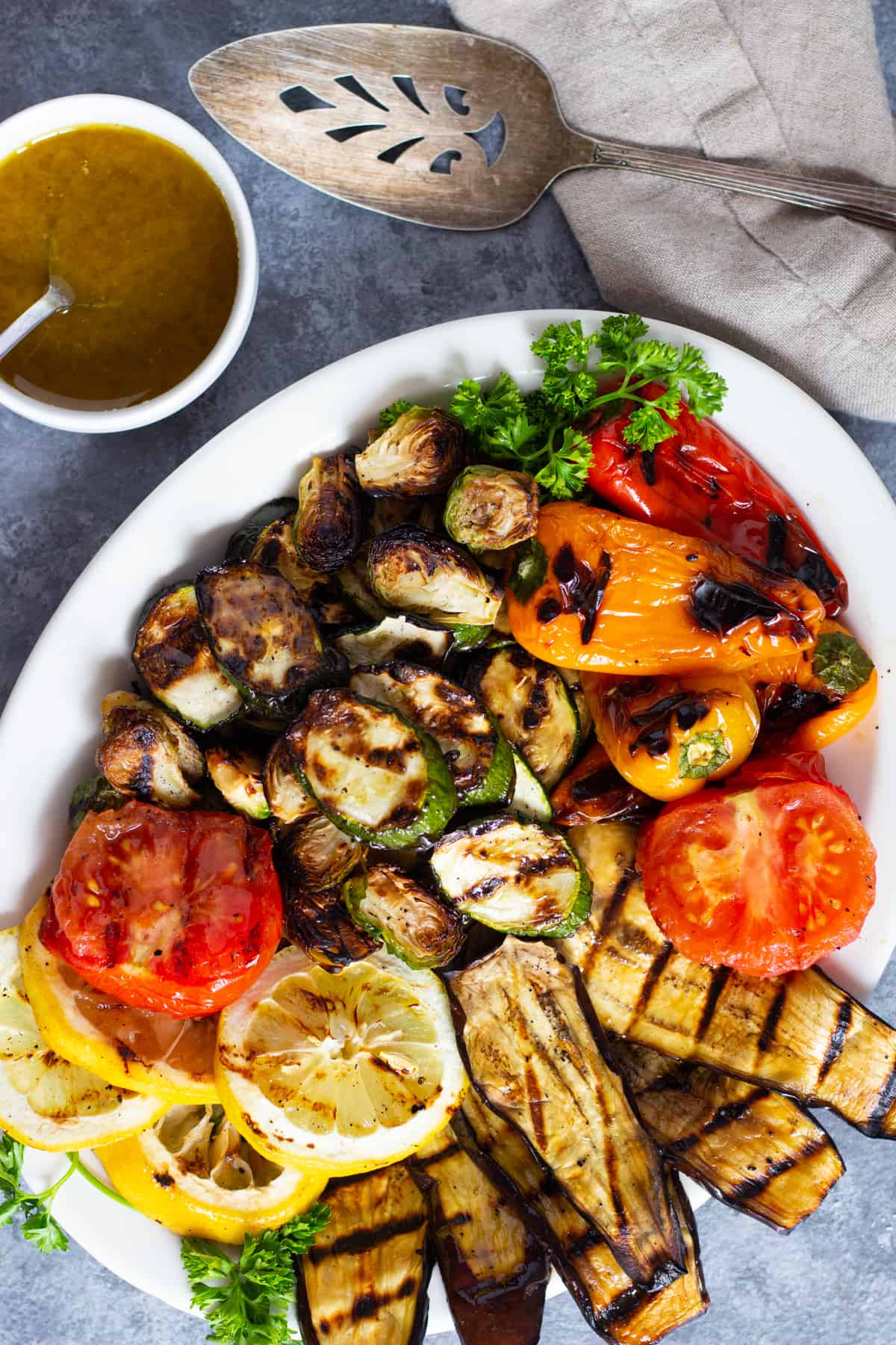 Grilled vegetable platter with a zesty dressing.
