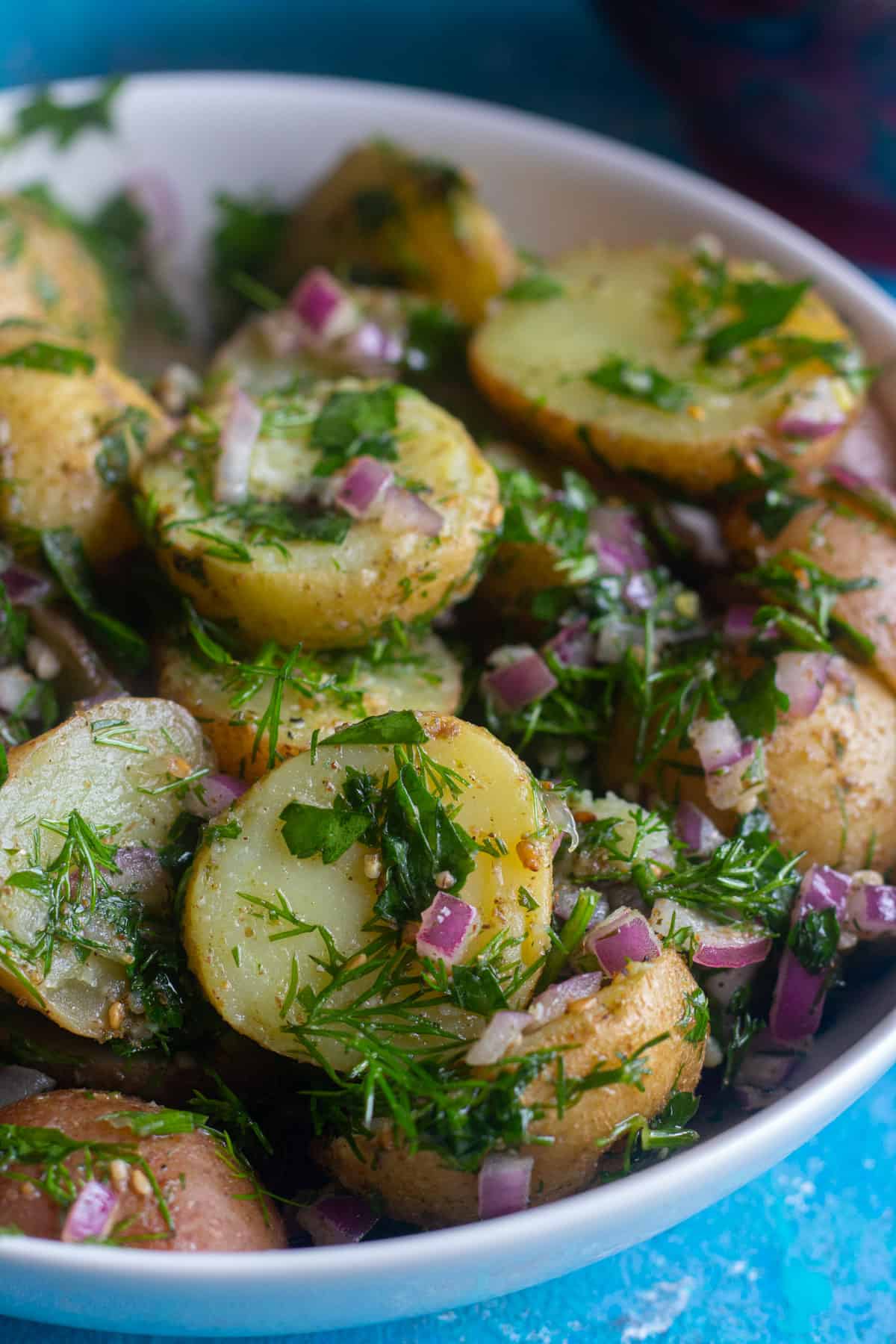 Mediterranean potato salad is so easy and simple. It's made with only a few ingredients and is packed with flavor thanks to a homemade zaatar dressing. 